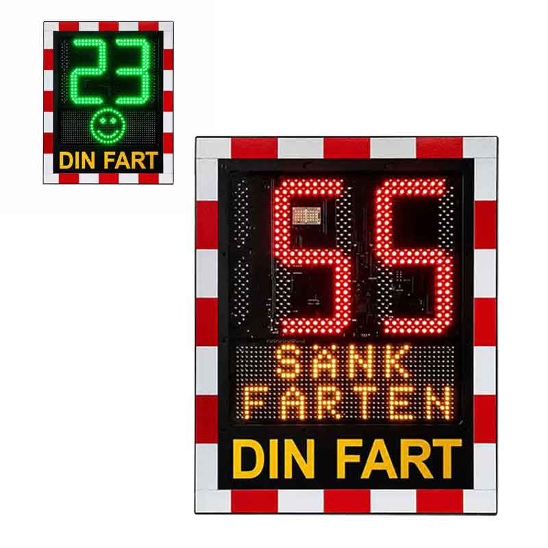Hastighetsdisplay Din Fart med grön smiley och hastighetsvisning 23 km/h samt röd varningsvisning med texten “Sänk Farten” för ökad trafiksäkerhet i bostadsområden, skolor och vägföreningar.