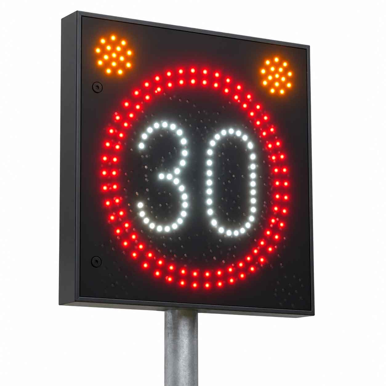Hastighetspåminnare med LED-skylt 30 km/h, röd ljusring och orange varningsljus på galvaniserad stolpe.